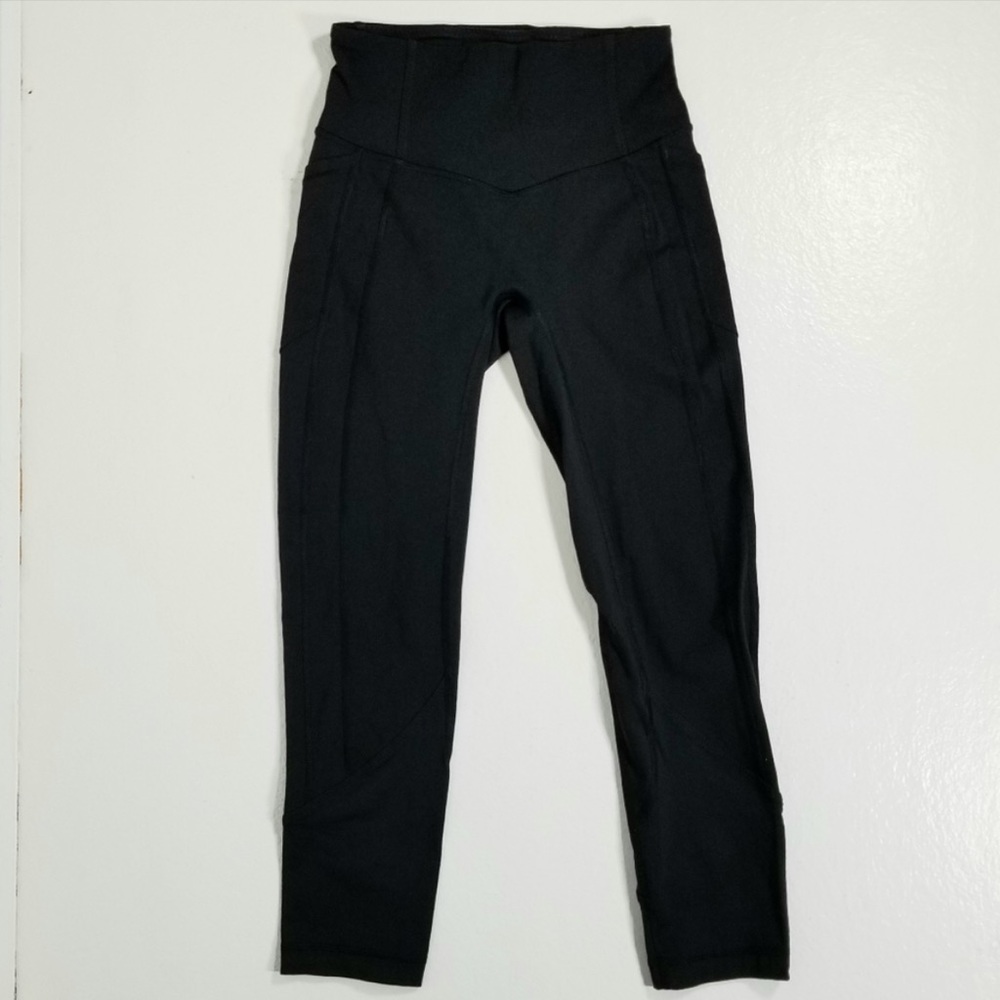 Lululemon black workout/yoga leggings, with side pockets, almost brand new.